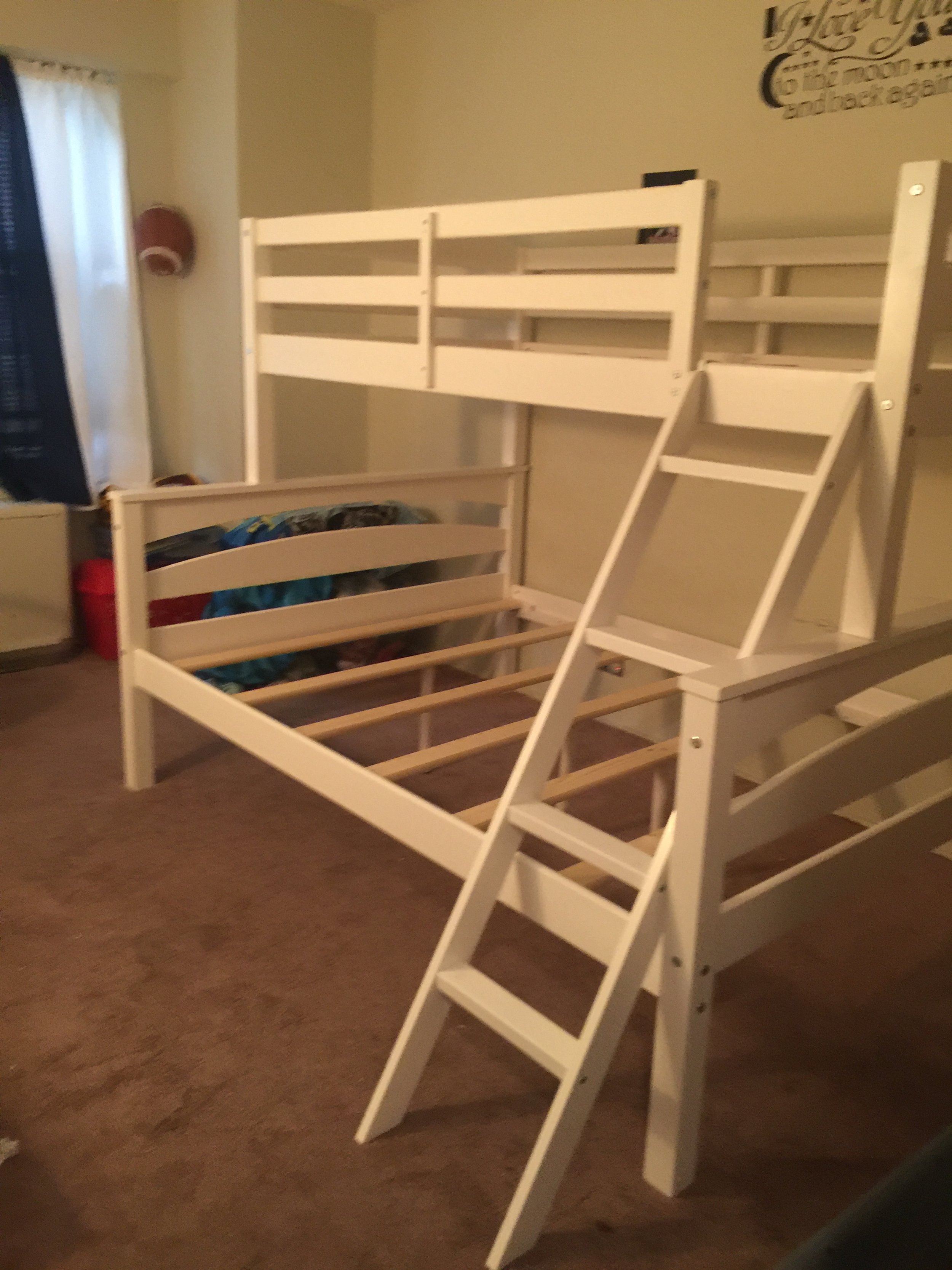 White wooden bunk bed with ladder assembled in a kids bedroom in Forest Hills Queens. Professional furniture assembly services.