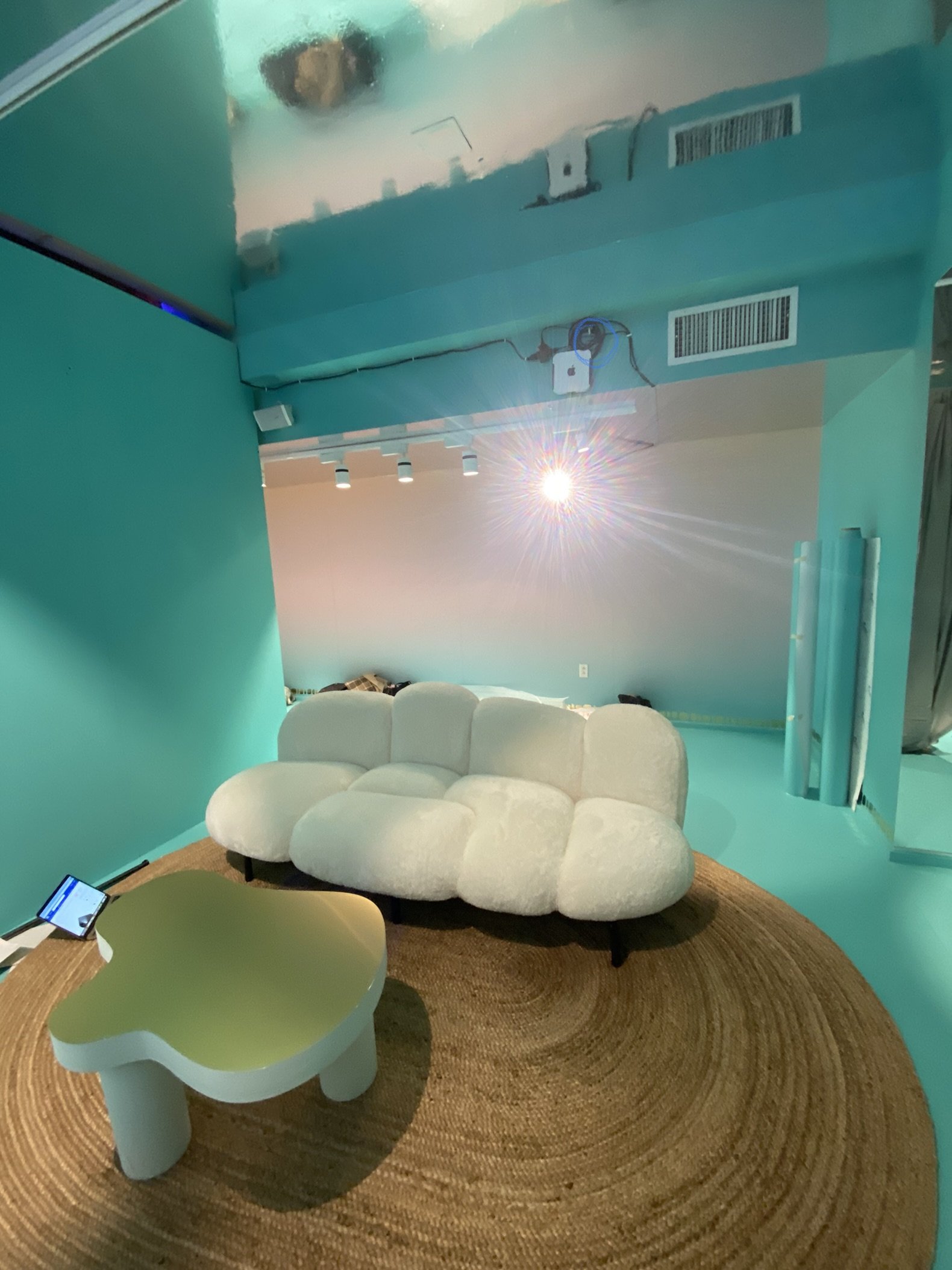 Projector mounted to ceiling in a room. Specialized ceiling mounting for home theater equipment.